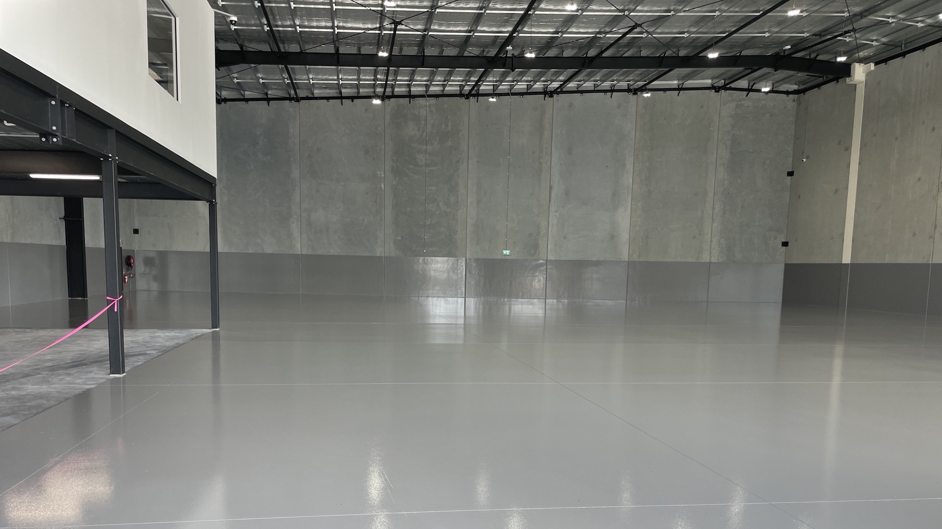 Commercial epoxy flooring in a large warehouse