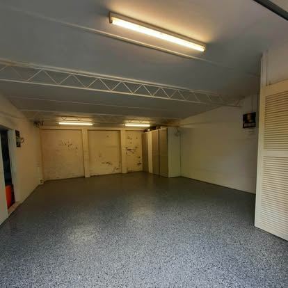 The same garage floor finished in flake epoxy