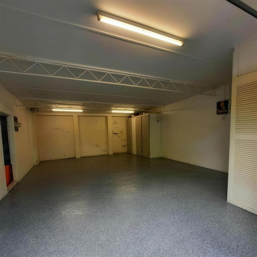The same garage finished with a full grey flake epoxy floor