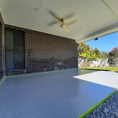 Solid colour coating on an alfresco slab, masking still down