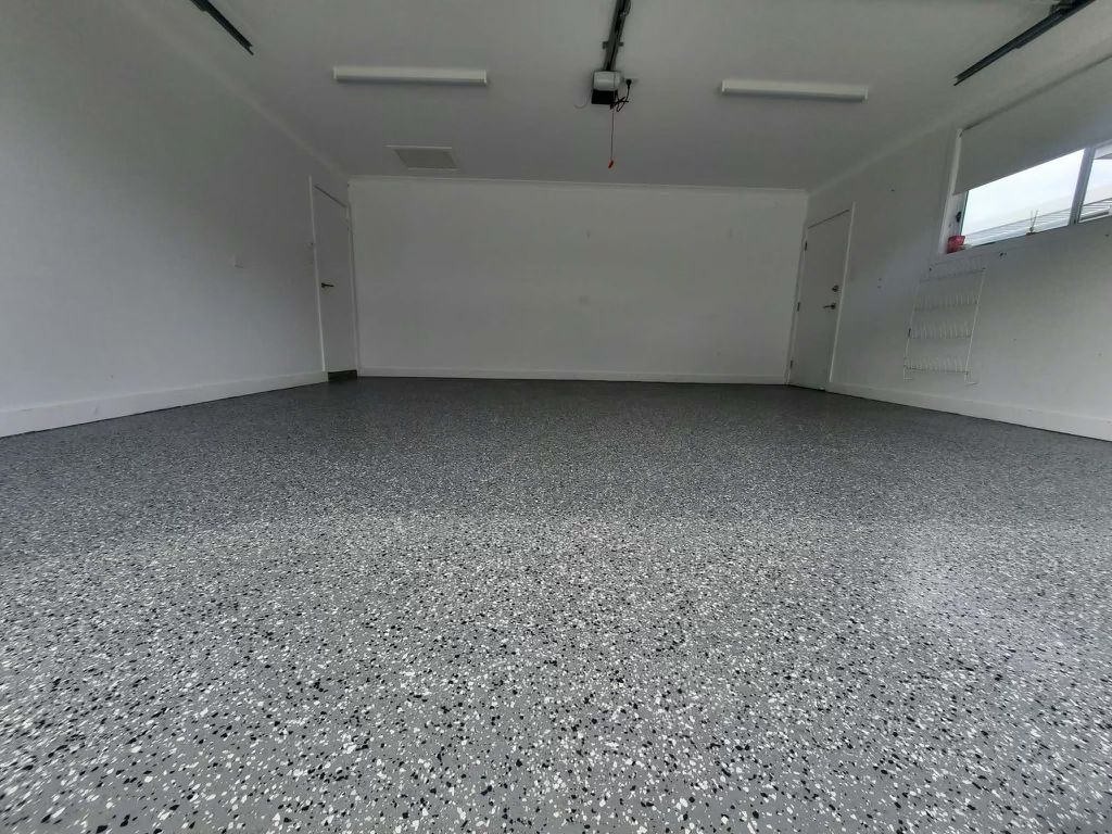 The same garage finished in a grey flake epoxy floor