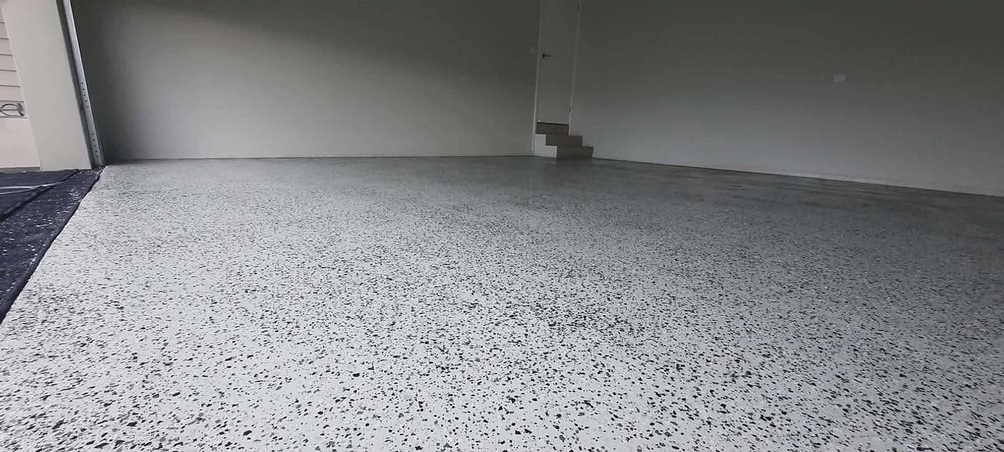 Completed flake epoxy garage floor by Floor Candy